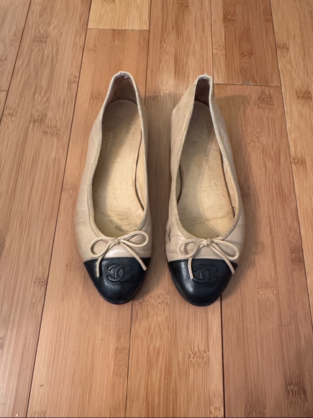CHANEL Beige Leather Ballet Flats with Black Cap Toe and CC Logo